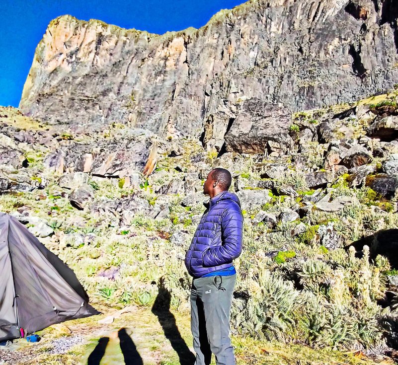 Hiker below the peaks of Mt Kenya